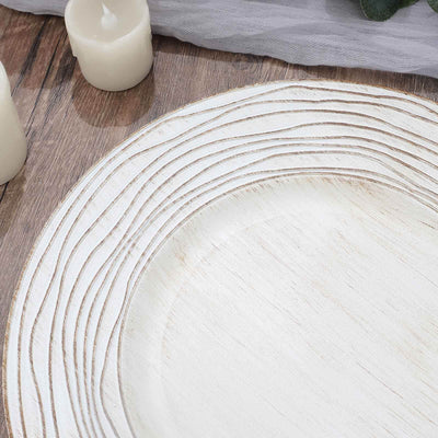 Textured white plate with subtle grooves on a rustic wooden table.