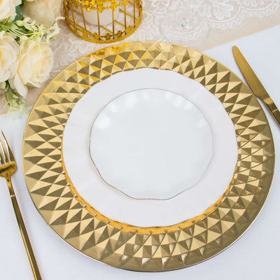 Elegant gold and white dinner plate set on a table with floral decor.