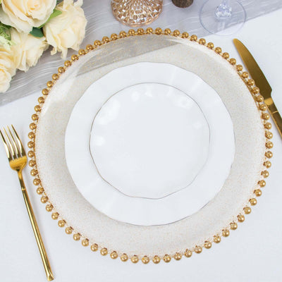 Elegant white plate on a gold beaded charger, set for a sophisticated dining experience.