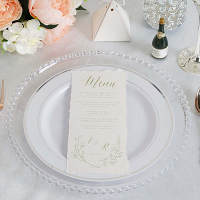 Elegant wedding menu on a decorative plate with floral accents.