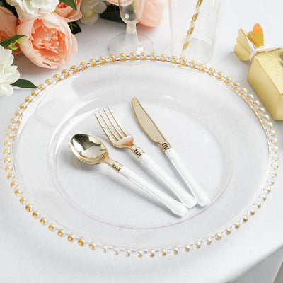 Elegant gold-accented cutlery set on a decorative plate