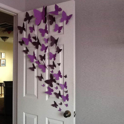 Colorful purple butterflies decoratively arranged on a door.