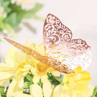 Decorative butterfly embellishment on yellow flowers.