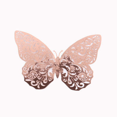 Rose gold decorative butterfly with intricate cutout design