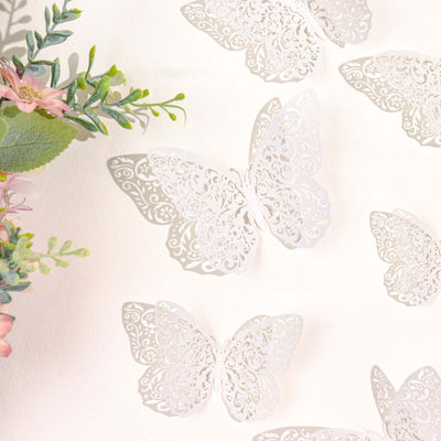 Elegant decorative paper butterflies on a white background.
