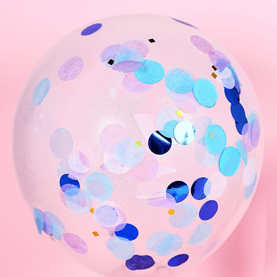 Clear balloon filled with colorful confetti dots on a pink background.