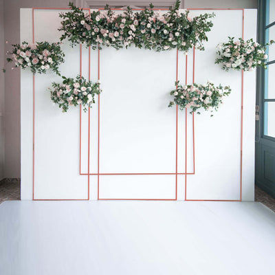 Floral backdrop with pink roses and greenery in a modern design.