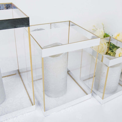 Elegant glass candle holders with gold accents on a white backdrop