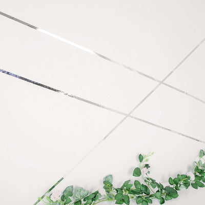Decorative wall with silver lines and floral accents