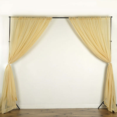 Sheer beige curtains on a black rod, elegantly draped.