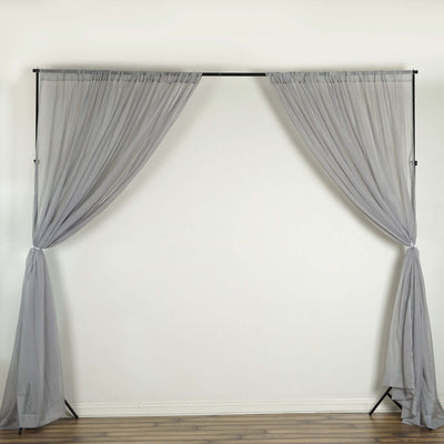 Gray sheer fabric curtains on a black frame for event decoration.