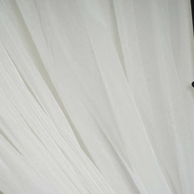 White sheer fabric draped elegantly, showcasing its delicate texture.