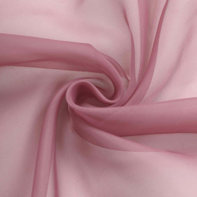 Pink sheer fabric swirling in soft folds, showcasing its delicate texture.