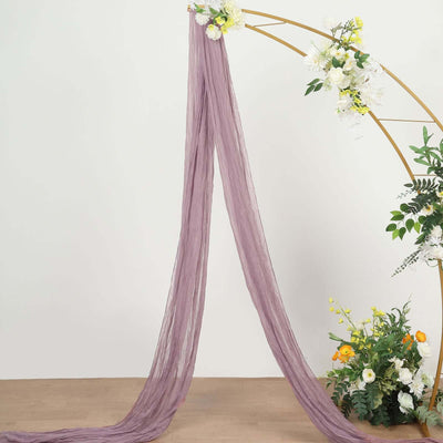 Purple sheer fabric draped elegantly, adorned with floral accents.