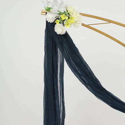 Navy chiffon fabric draped elegantly with floral accents