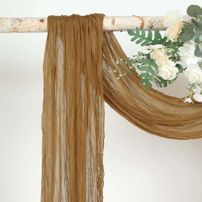 Brown chiffon fabric draped elegantly with floral accents.