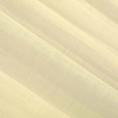Textured light yellow fabric in soft folds.