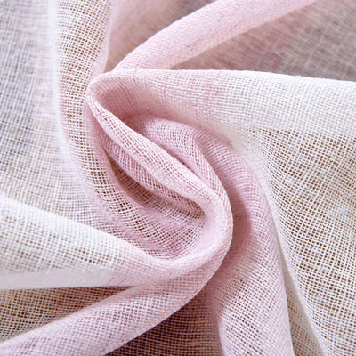 Close-up of soft pink and white fabric texture.