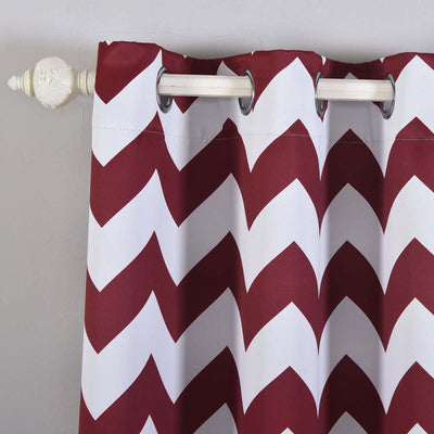 Red and white chevron pattern curtain with grommets.