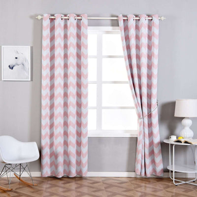 Pink chevron patterned curtains hanging by a window in a modern living room.