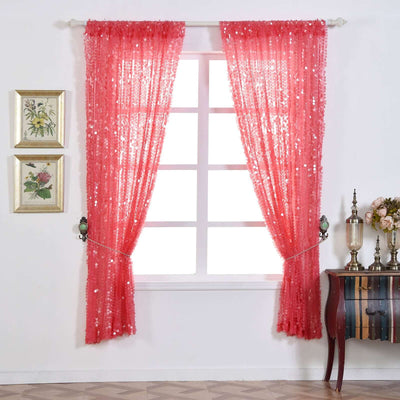 Sheer coral curtains with sequins hanging in a bright room setting.