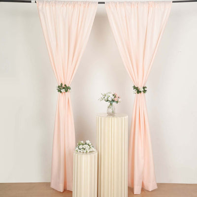 Peach curtains with floral ties, displayed in a styled setting.