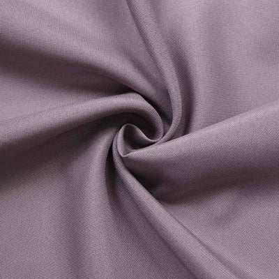 Textured purple fabric close-up, showcasing its soft and smooth surface.