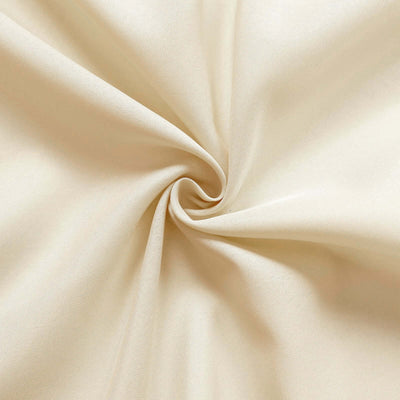 Beige fabric texture in a spiral pattern.