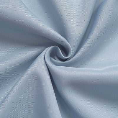 Light blue fabric texture in a swirl pattern.