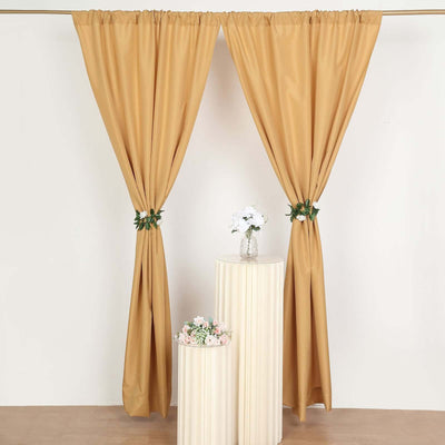 Elegant beige curtains with floral accents on a white background.