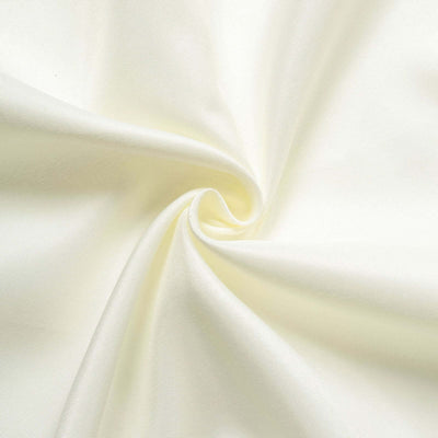 Cream-colored fabric showing a smooth, twisted texture.