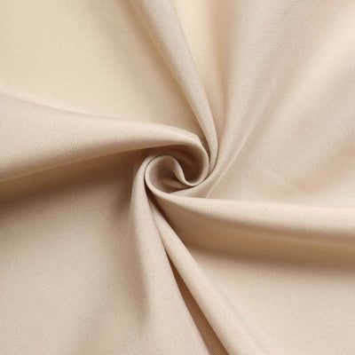 Beige fabric with a smooth texture, elegantly twisted in a spiral pattern.