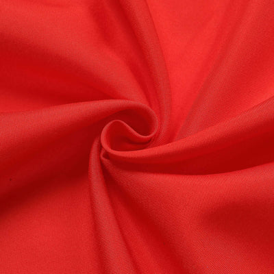 Red fabric texture with smooth, flowing drape.