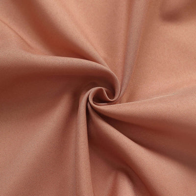 Peach-colored fabric with a smooth, soft texture.