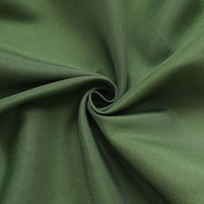 Green textured fabric in a swirl pattern.