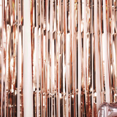 Rose gold fringe backdrop for parties and events.