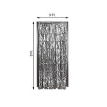 A metallic foil silver fringe curtain with measurements on a white background