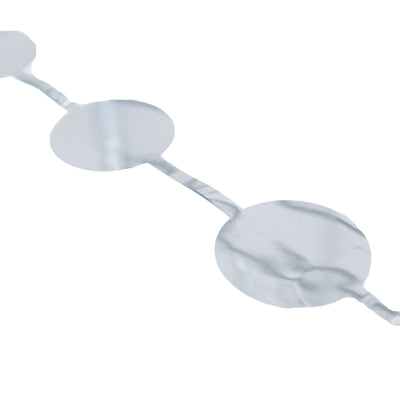 Silver circular foil tape on a plain background.