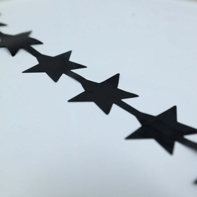 Black star-shaped stickers on a white background