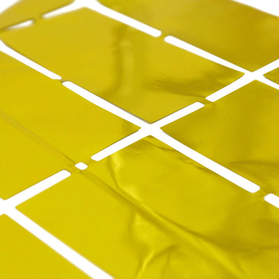 Yellow adhesive vinyl sheets cutout on a white background.