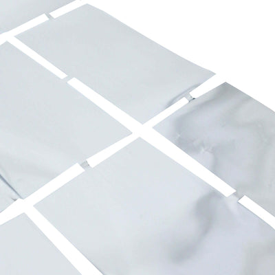 White vinyl flooring planks arranged in a staggered pattern