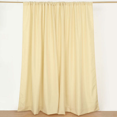 Cream-colored curtain panel, elegantly draped for a soft look.