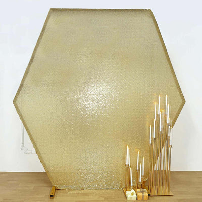 Hexagonal gold backdrop with decorative candle holders