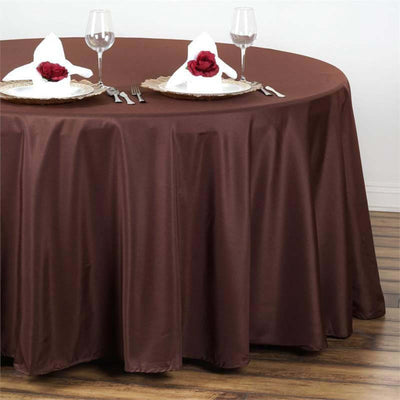 Brown round tablecloth draped elegantly on a table set for two.