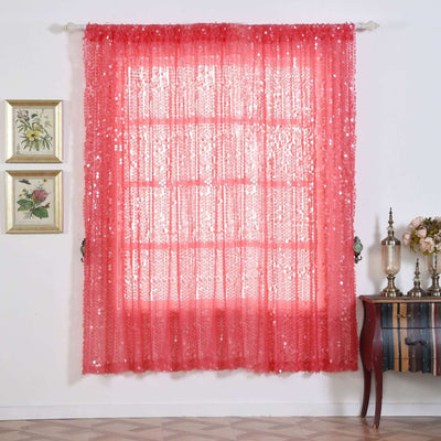Pink sequin curtain hanging in a decorative room setting.