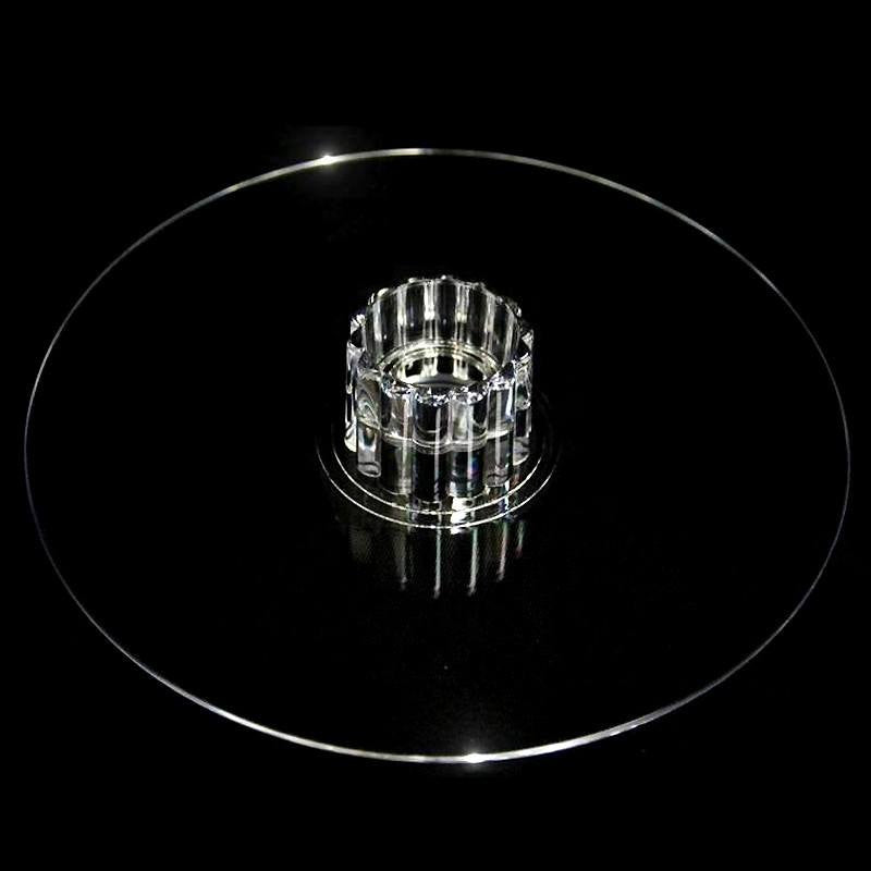 Clear glass cake stand with a decorative base