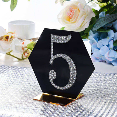 Black hexagon table number "5" adorned with rhinestones.