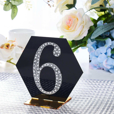 Hexagon table number 6 with rhinestones on a sleek stand.