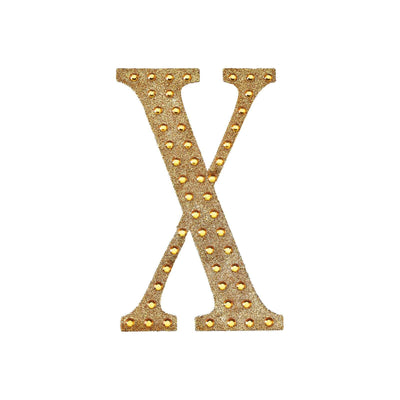 Gold glitter letter X with rhinestones on a white background.