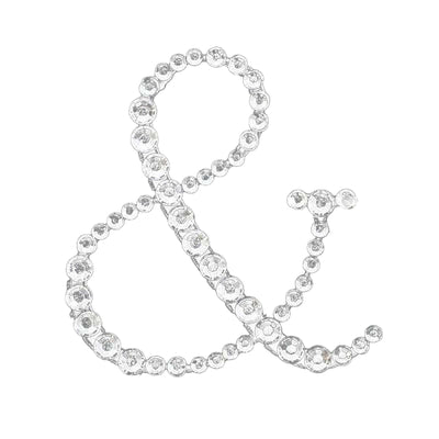 Rhinestone ampersand decoration on a white background